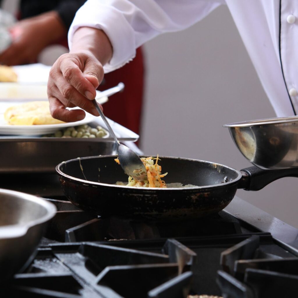 man cooking with skillet