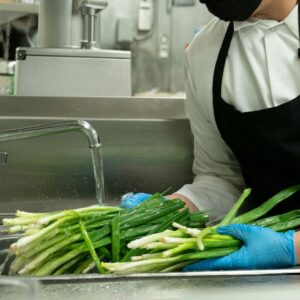  a chef washing vegetables