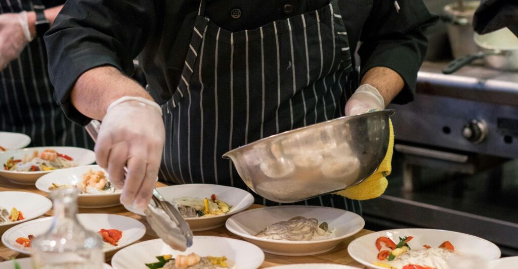 a chef plating food