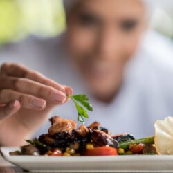 chef topping a dish