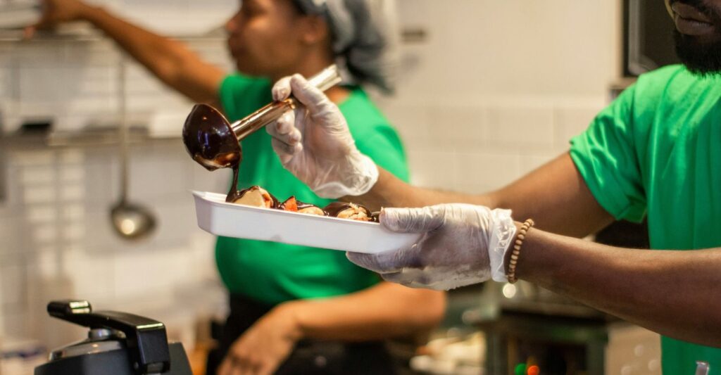 People making food in a commercial kitchen