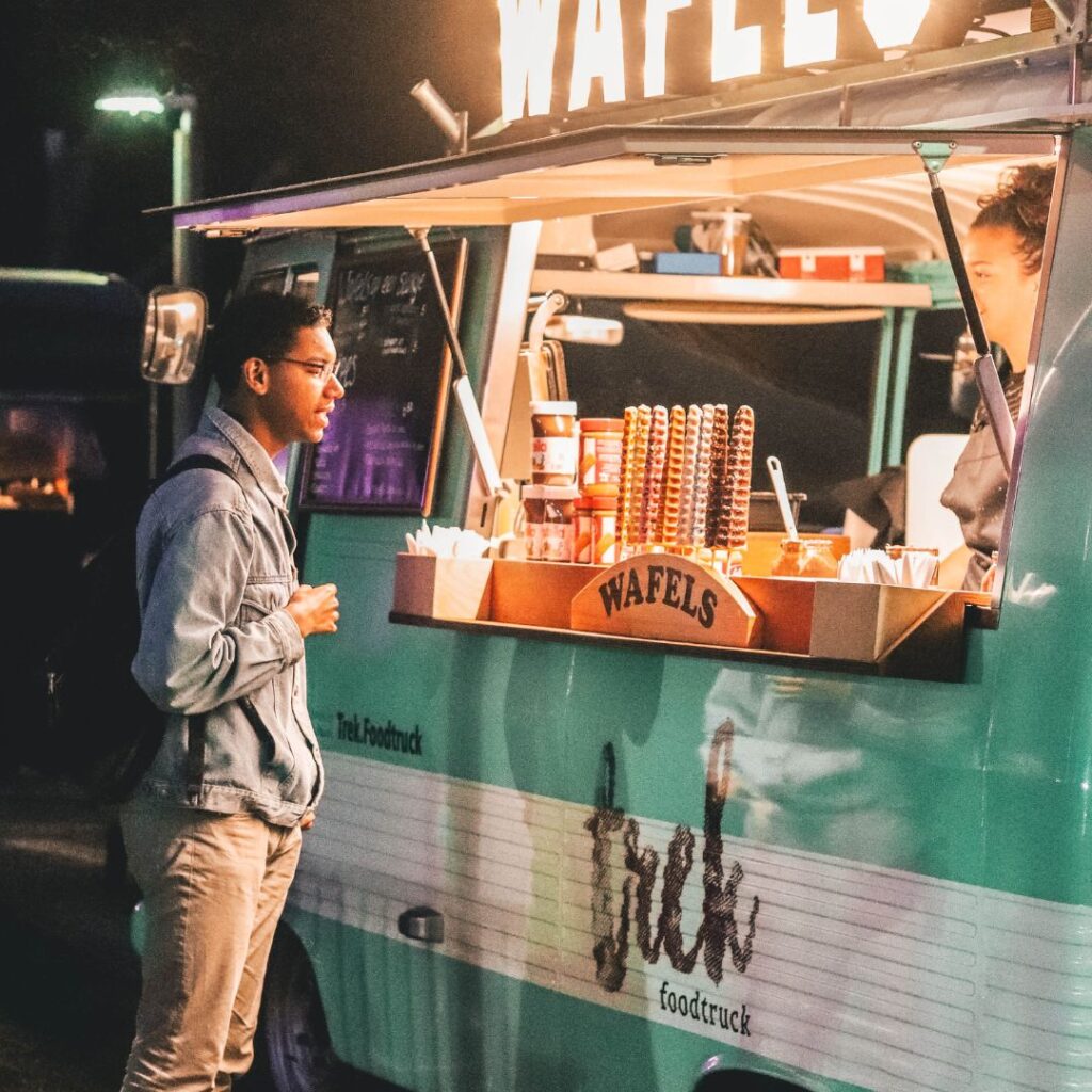 person ordering from food truck