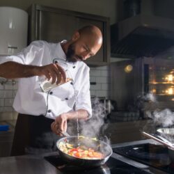 chef cooking with Green Business badges